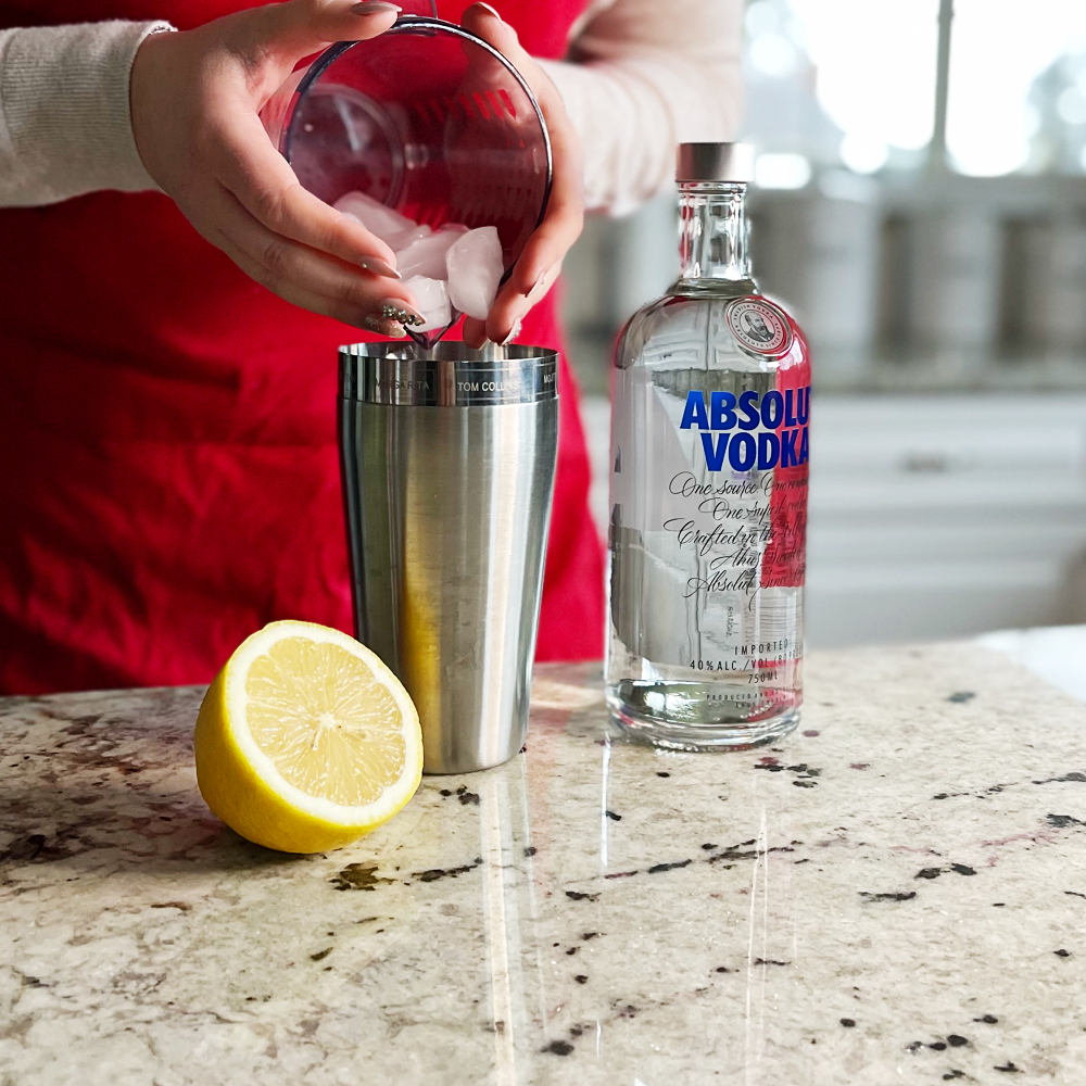 pouring ice into shaker