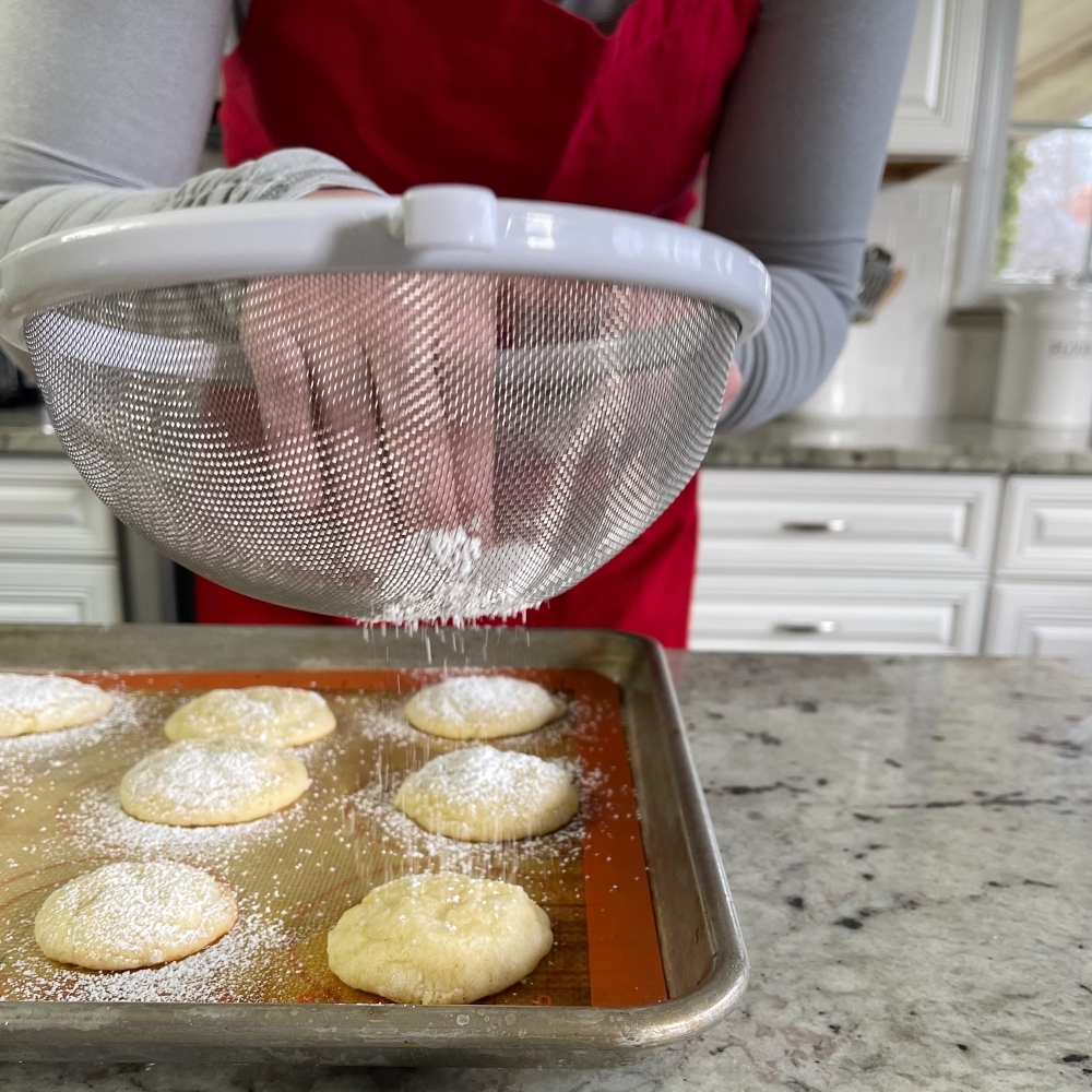 Simple Lemon Crinkle Cookies Recipe 16 sifting powdered sugar on lemon cookies