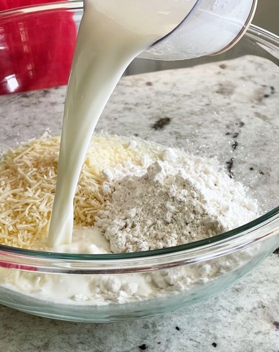adding milk to batter ingredients