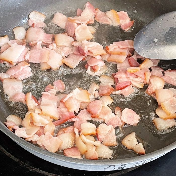 frying bacon in skillet