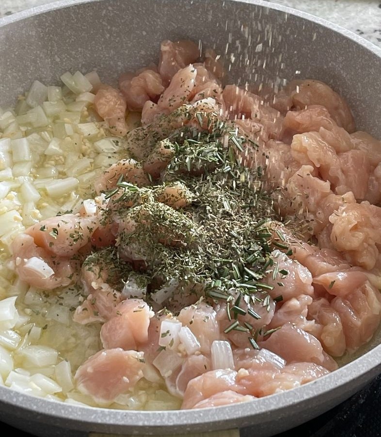 saut&eacute; chicken onion garlic and seasonings in skillet