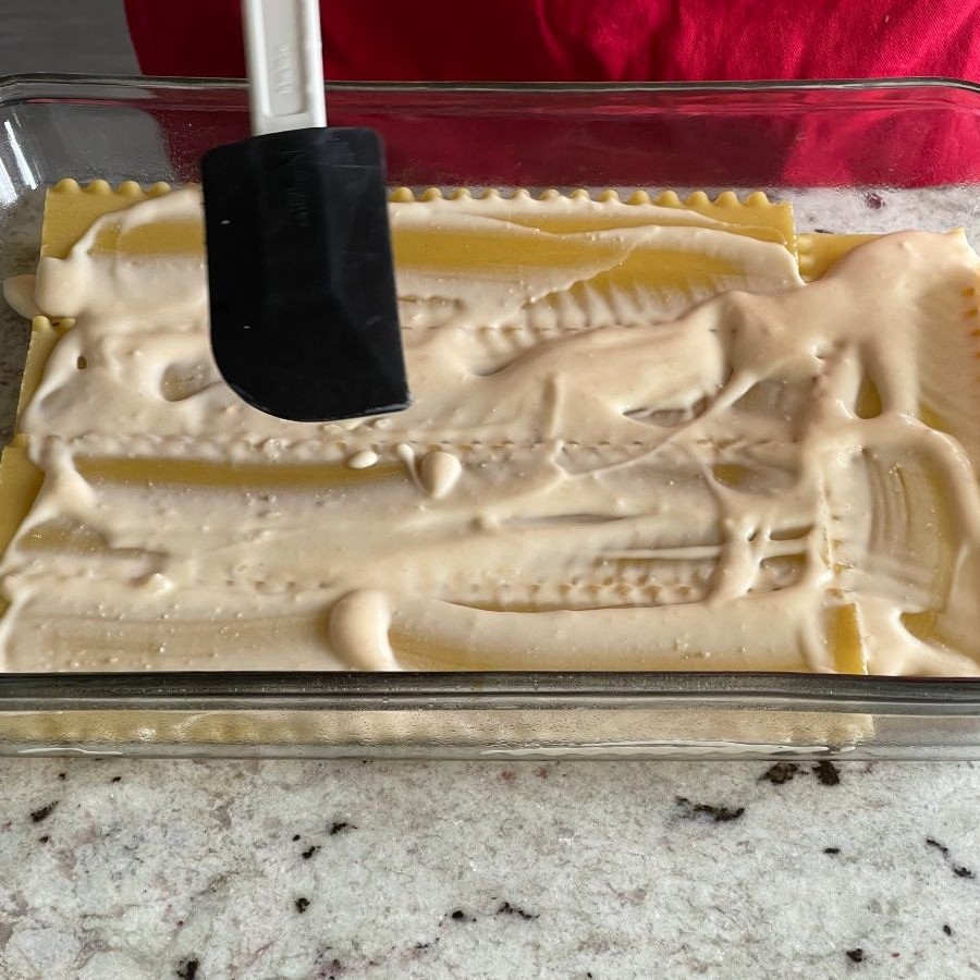 smooth sauce over noodles