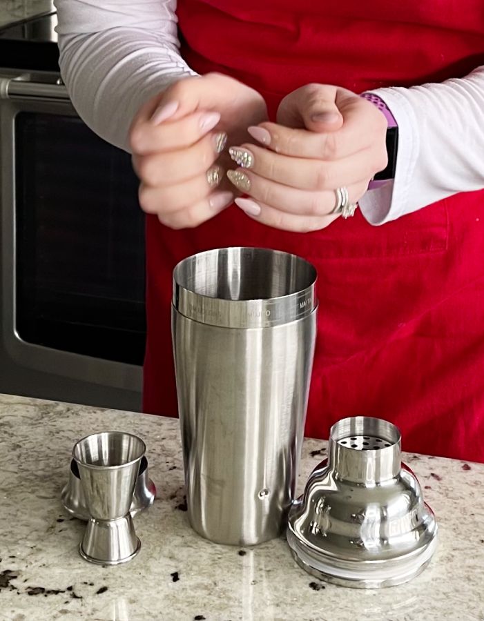 adding ice to a shaker