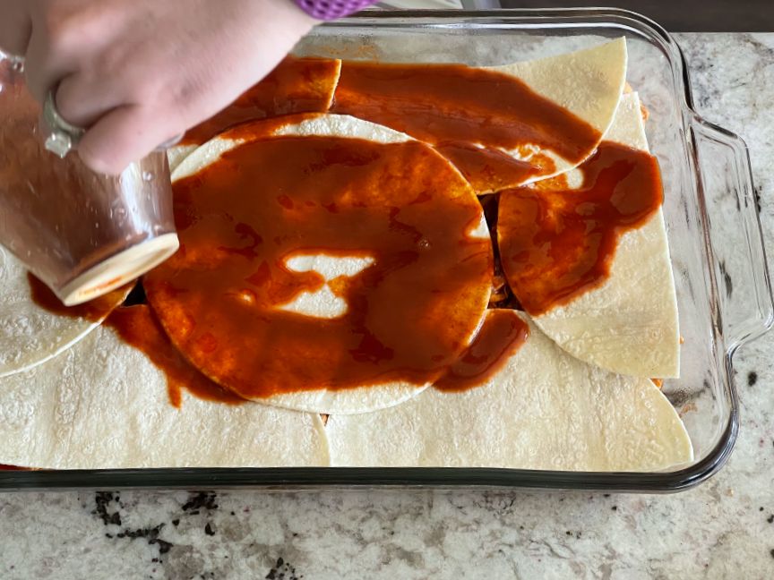 layer tortillas over chicken- then sauce