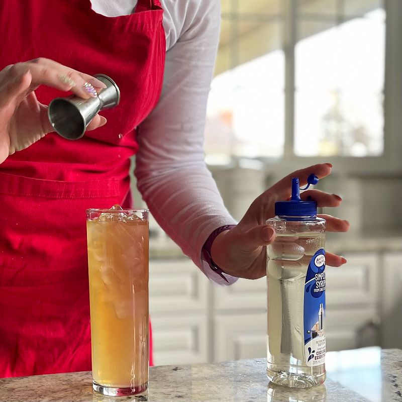 pouring simple syrup arnold palmer drink