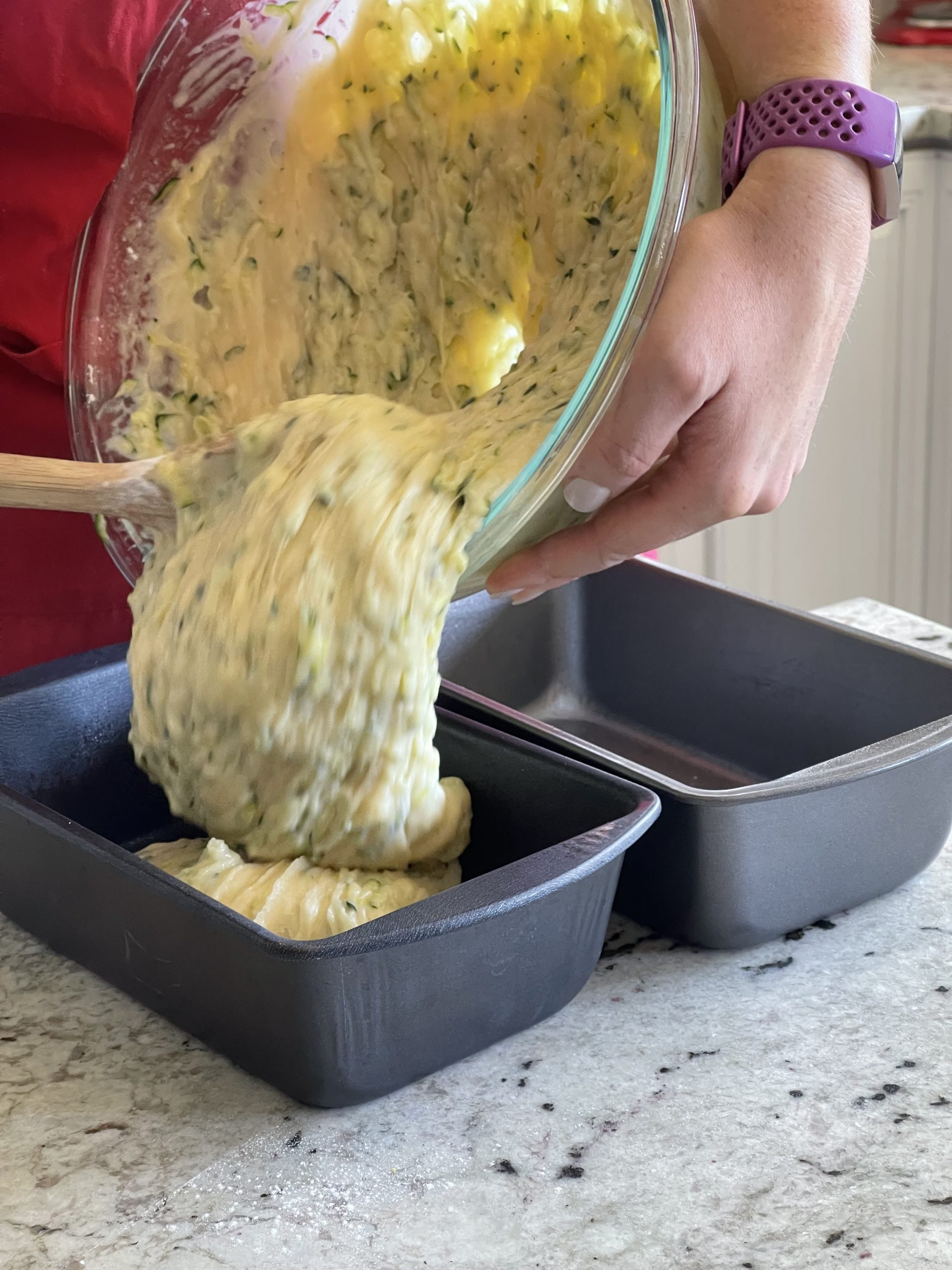evenly pour batter into oiled bread pans
