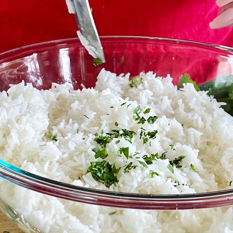 adding cilantro to lime rice