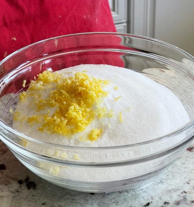 lemon zest and sugar in a clear bowl