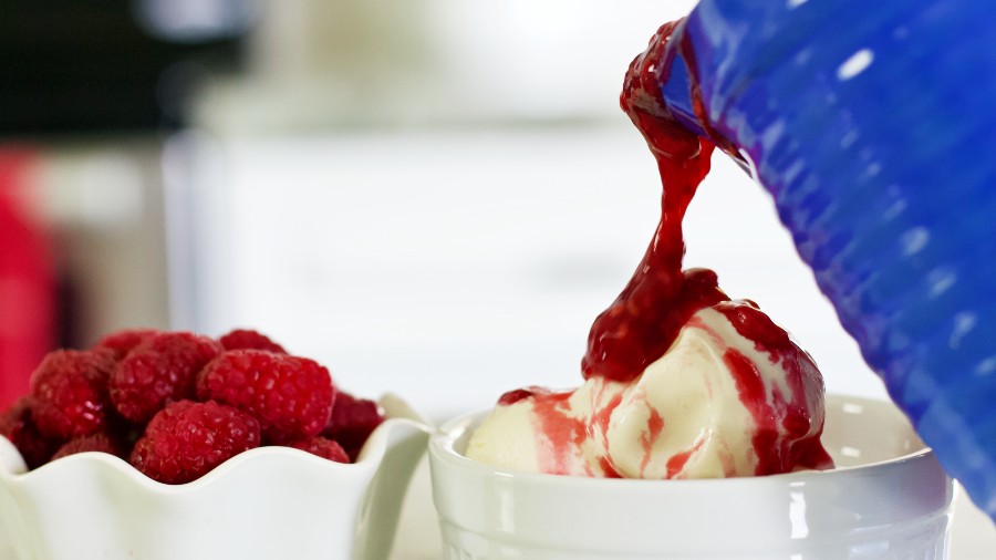 pouring raspberry sauce