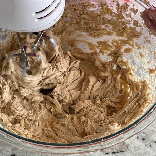 mixing eggs into wet ingredients-dark chocolate chip cookies