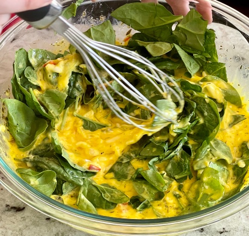 adding spinach-spinach quiche