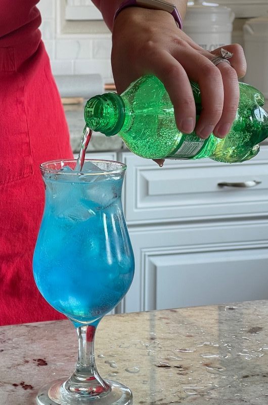 topping blue motorcycle drink with soda