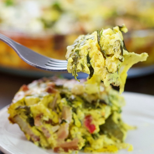 forkful of crustless spinach quiche