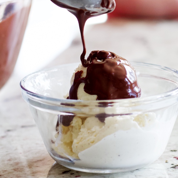 chocolate ganache pouring on ice cream