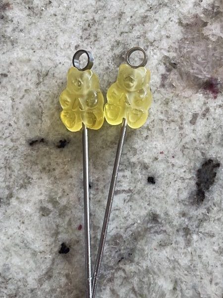 white gummy bears on picks