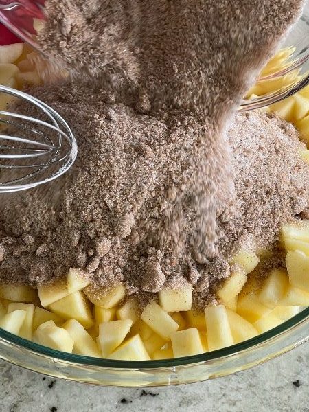 adding apple pie spices to apples