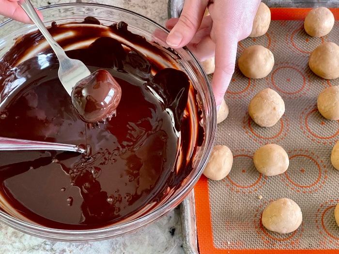 dipping truffles in melted chocolate