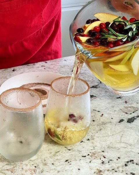 pouring sangria into cups