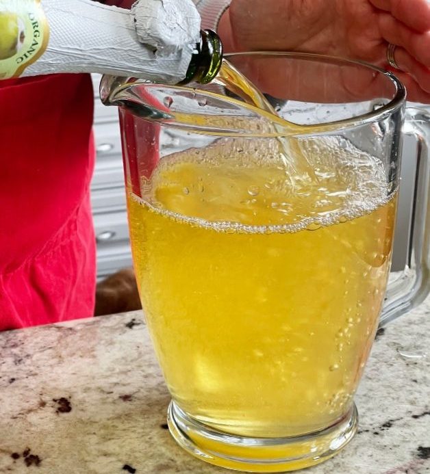 pouring sparkling cider-sangria