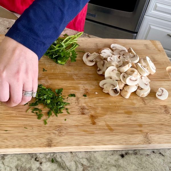 prepping mushrooms and parsley
