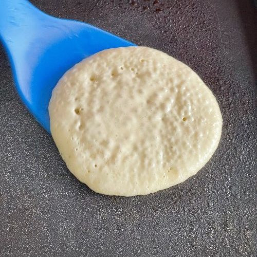 flipping sourdough pancake