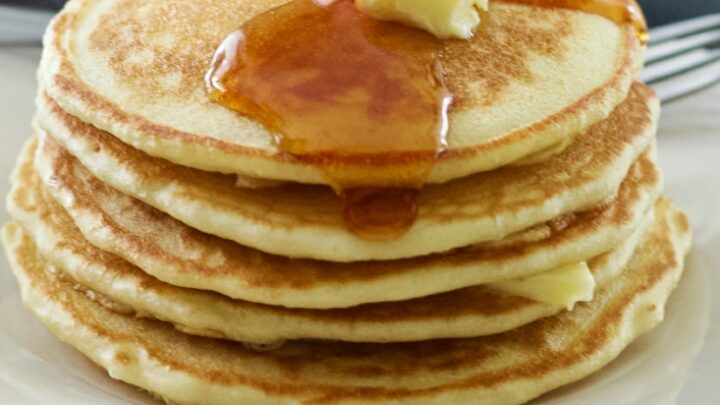 stack of sourdough pancakes with butter and syrup