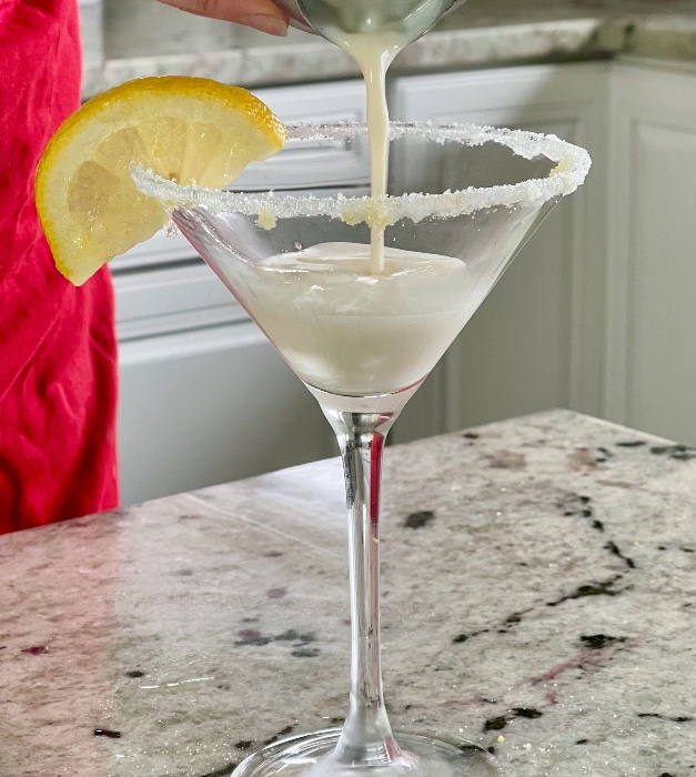 Simple Lemon Cake Martini Recipe 3 pouring a lemon cake martini