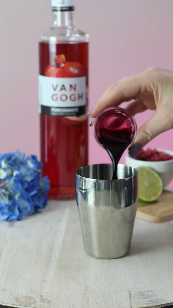 pouring blueberry simple syrup
