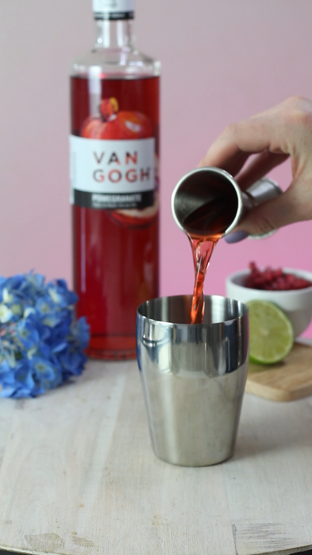 pouring pomegranate vodka