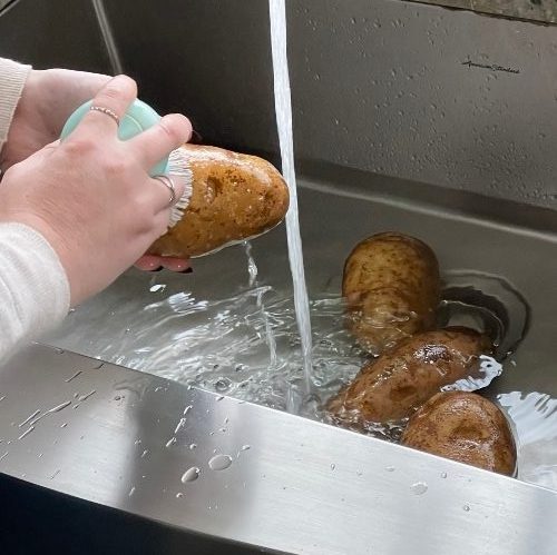 washing potatoes