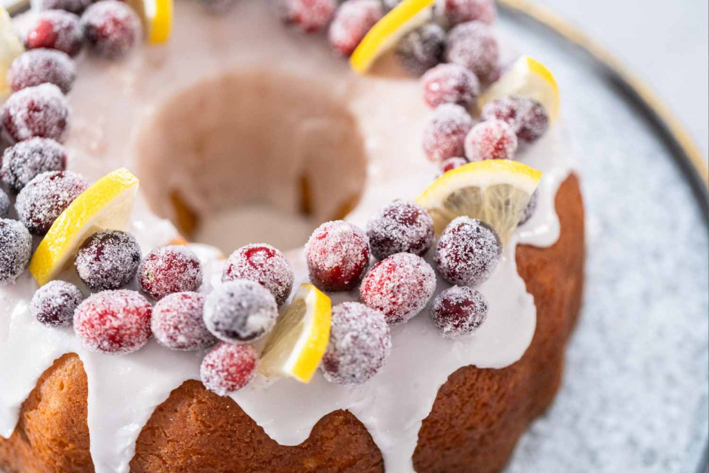 sugared cranberries and fruit decorating a bundt cake