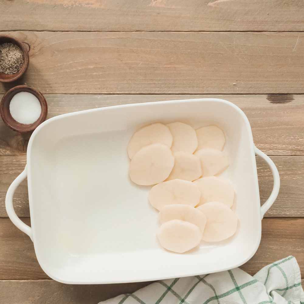 laying out potatoes slices