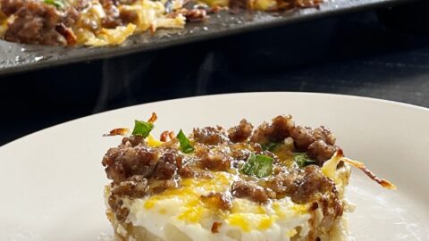 egg muffin cups in pan and one on a small white plate