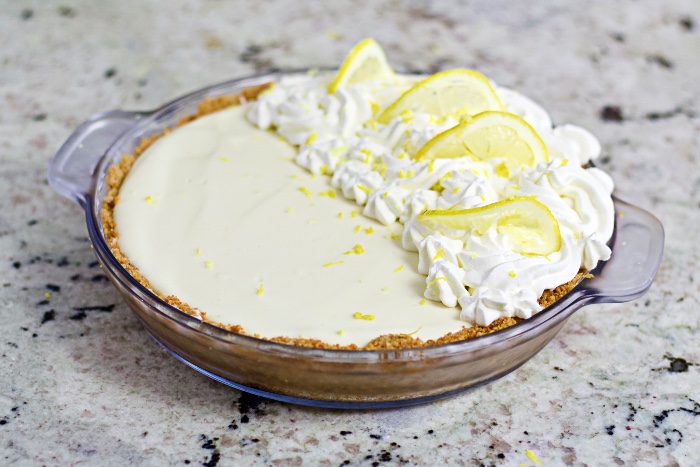 lemon cream pie with a simple whipped cream and lemon topping.