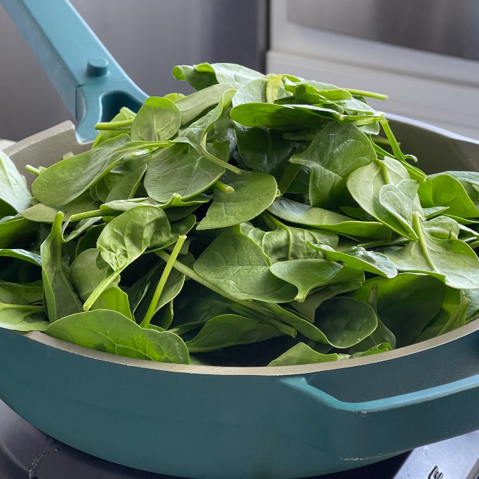 adding spinach