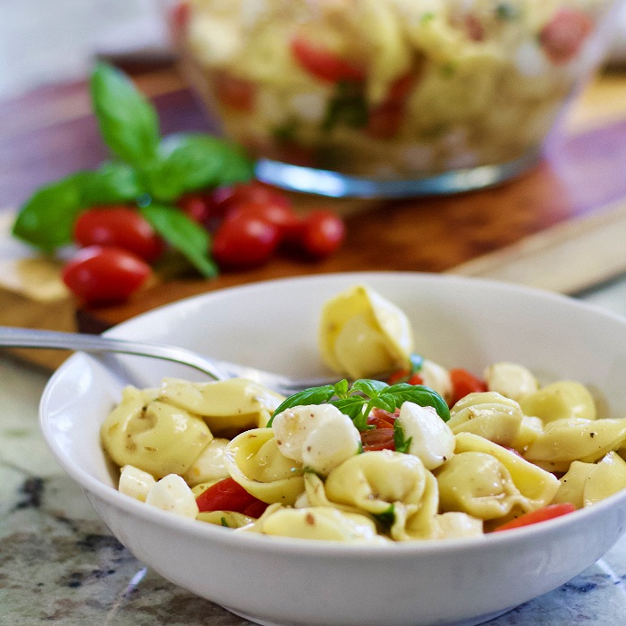 tortellini caprese salad in bowl