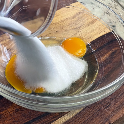 adding sugar to eggs-waffle cone batter