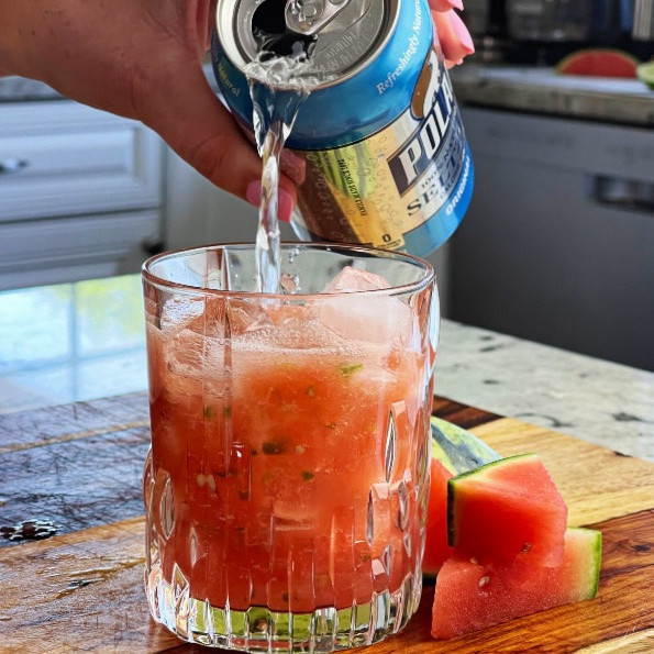 pouring seltzer water into watermelon jalape&ntilde;o pulp