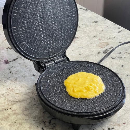 correct amount of batter is 1/4 Cup. place in center of waffle iron