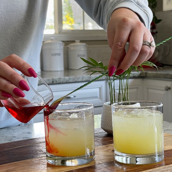pouring grenadine over spoon