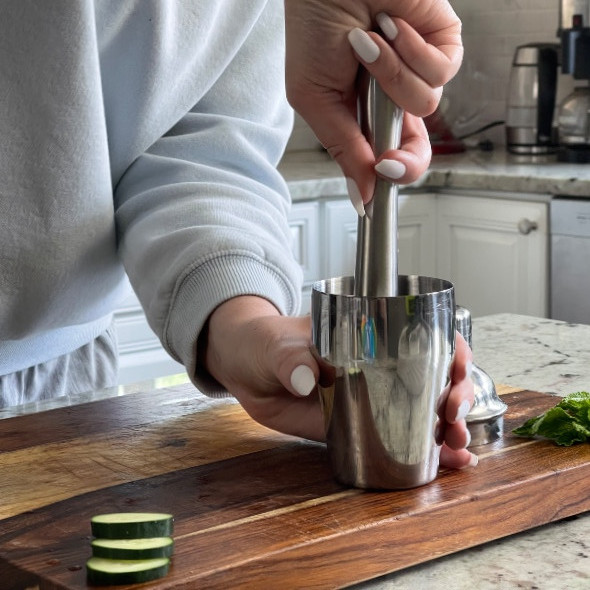 muddling mint and lime juice