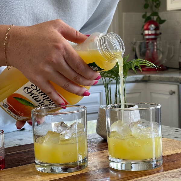 pouring orange juice