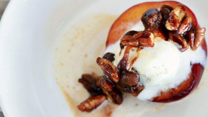candied pecans and ice cream over fried peach dessert