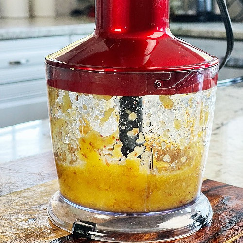 pureeing a peach in a food processor-peach Bellini