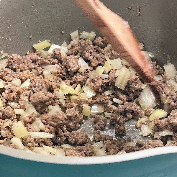 cooking the sausage-creamy tortellini soup