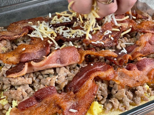 sprinkle cheese over bacon layer