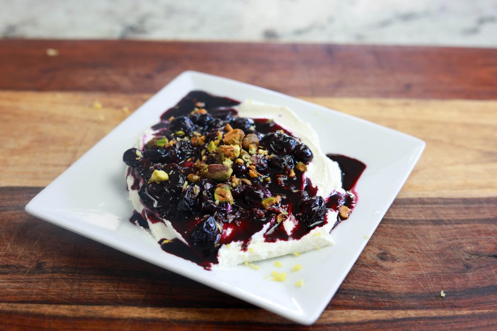 Easy Goat Cheese Appetizer with Cranberries and Pistachios 7 whipped goat cheese topped with a homemade blueberry compote and chopped pecans