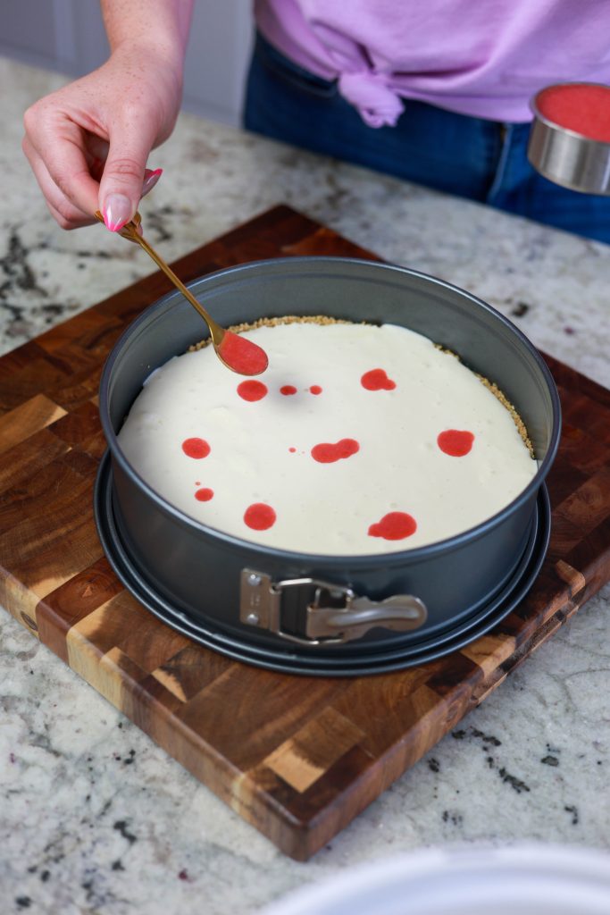 add drops of strawberry sauce 