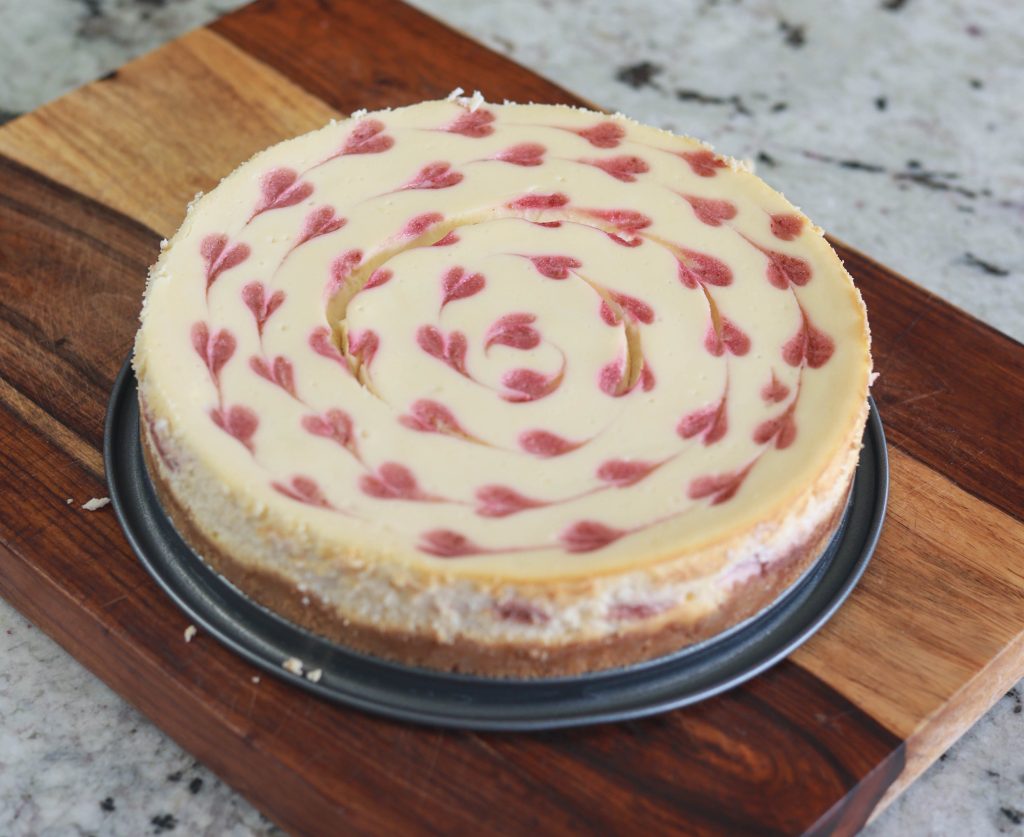 a cheesecake with hearts on top
