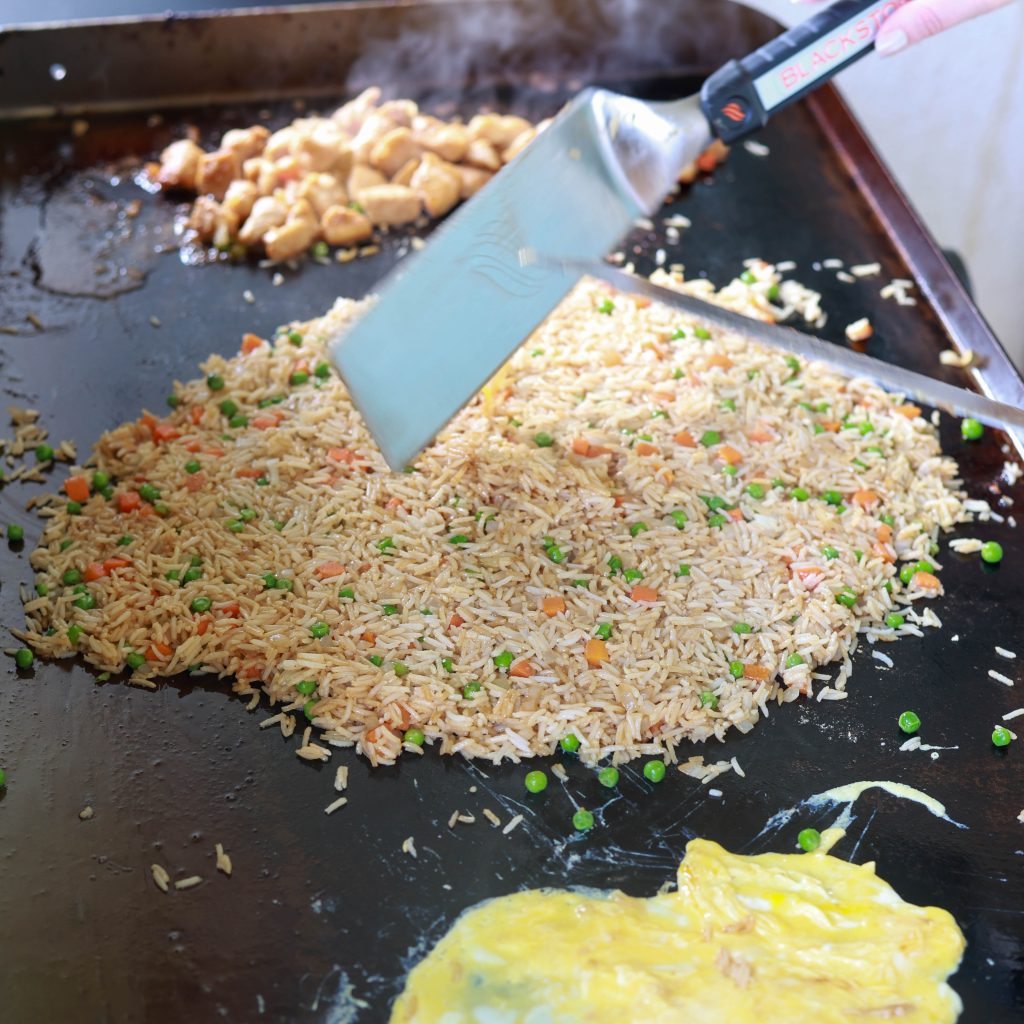 Griddle cooking chicken fried rice